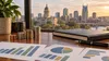 Stacks of coins, abstract financial charts and a ledger overlooking a Tennessee capitol-style skyline