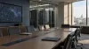 An unoccupied federal technology policy briefing room with server cabinets and an abstract network display