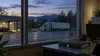 A generic semi-truck outside a quiet Vermont motor-vehicle office at blue hour, illustrating commercial licensing and data privacy.