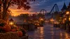 Generic autumn amusement park walkway at dusk with pumpkins, warm lanterns and roller coaster silhouettes