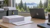Illustrative ballot envelopes and a secure laptop in a Washington election office