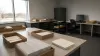 Unbranded election office workspace prepared for processing mail ballot records