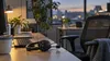 An empty crisis counseling workstation with a telephone headset and computer keyboard in soft evening light.