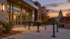 Illustrative view of an empty Wisconsin polling-place entrance at dusk.