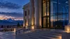 Generic Wyoming courthouse at blue hour with subtle server-room reflections suggesting court data security