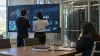 Illustrative image of independent reviewers examining AI monitoring dashboards in a secure audit lab