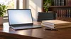AI-generated editorial illustration of an unbranded laptop and closed legal folders on a desk; not a photograph of the Arkansas litigation.
