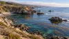 AI-generated editorial illustration of a generic California rocky coastline with kelp beds offshore; not a photograph of Point Sal, Carpinteria Reef or a newly designated conservation area.