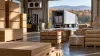 Plywood sheets, wooden crates and refrigerated freight staged in a cross-border warehouse