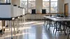 Empty polling place prepared with privacy voting booths and tables in natural morning light