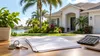 Illustrative Florida home with a house key, calculator and blank property-assessment papers on a table.