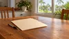 AI-generated editorial illustration of a plain home-recovery paperwork folder on a table in a generic Florida residence; not a photograph of a storm survivor or damaged property.
