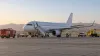 Illustrative image of an unmarked passenger jet after an emergency diversion at a Middle Eastern airport