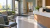 AI-generated editorial image of a quiet accessible health clinic waiting area with policy folders on a reception desk