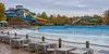 A generic Midwestern outdoor water park sits empty on a cool autumn morning after the summer season.