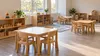 AI-generated illustration of an empty generic child-care classroom with small tables, chairs and toy shelves; not a photograph of a particular Indiana provider.