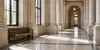 AI-generated illustrative image of an empty courthouse corridor with stone columns and natural window light; not a photograph of the Iowa case.