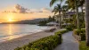 Quiet Caribbean beachfront resort at sunrise, shown as an illustrative travel scene