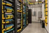AI-generated illustration of generic fiber-optic network equipment in a server room; not a photograph of KentuckyWired facilities.