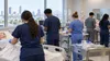 Illustrative view of anonymous nursing and allied-health students training in a clinical simulation classroom.