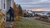 A Maine home and heating-oil delivery equipment on a cool autumn morning, illustrating winter fuel costs.