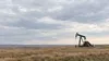 AI-generated editorial illustration of an unbranded pumpjack on open prairie evoking North Dakota’s oil region; not a photograph of a research test site.
