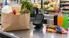 Illustrative grocery checkout with eligible staple foods separated from generic sweetened drinks and candy.