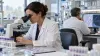 Hematology researchers examine blood samples and clinical data in a hospital laboratory.