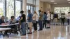 Voters wait in an orderly line at a Florida early-voting location.