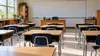 AI-generated illustration of a generic empty public-school classroom; not an actual Maryland school or the announcement site.