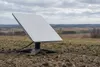 AI-generated illustration of an unbranded satellite internet terminal in a rural landscape; not a photograph of the reported disruption.