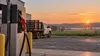 Editorial illustration of an unbranded red-handled diesel pump, generic farm truck and Virginia field at sunrise.