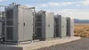 AI-generated illustrative view of unbranded modular power-equipment cabinets in a generic industrial setting; not a photograph or rendering of AEP’s proposed Wyoming facility.
