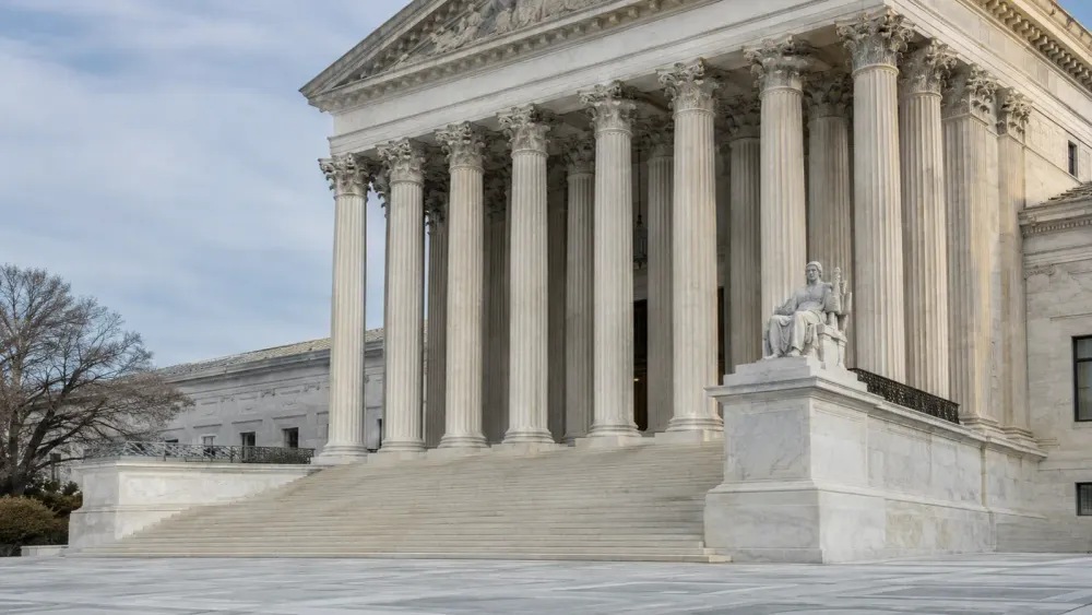 The United States Supreme Court’s marble steps and columns in soft morning daylight