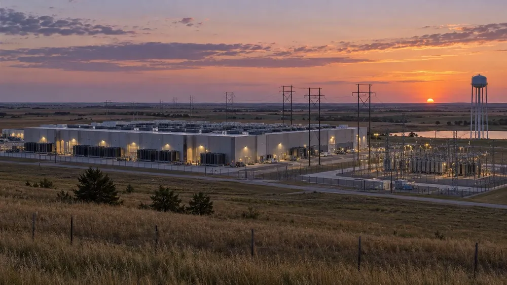 Large data center, electric substation and water tower on the Kansas prairie at sunset