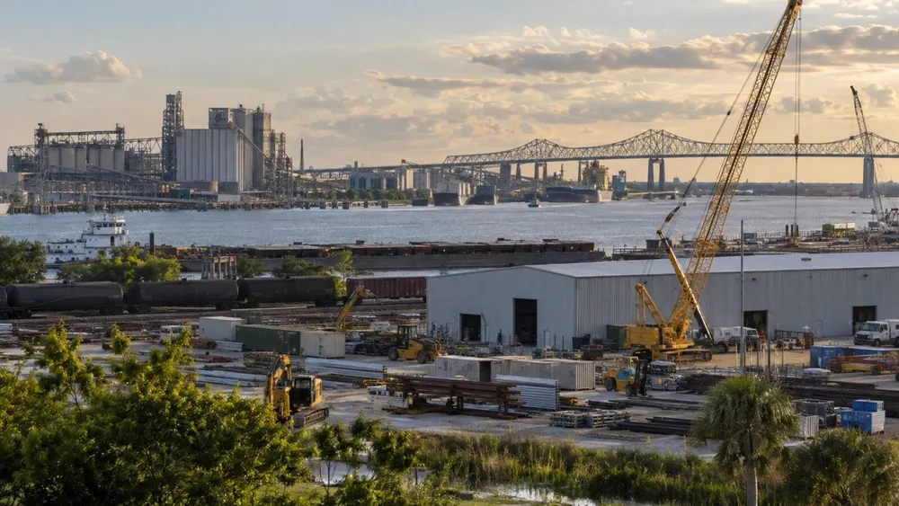 An industrial construction district beside a Louisiana waterway in late-afternoon light