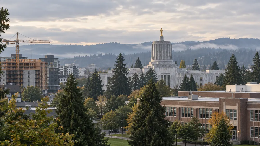 Oregon Capitol, housing construction and a school campus under overcast morning skies