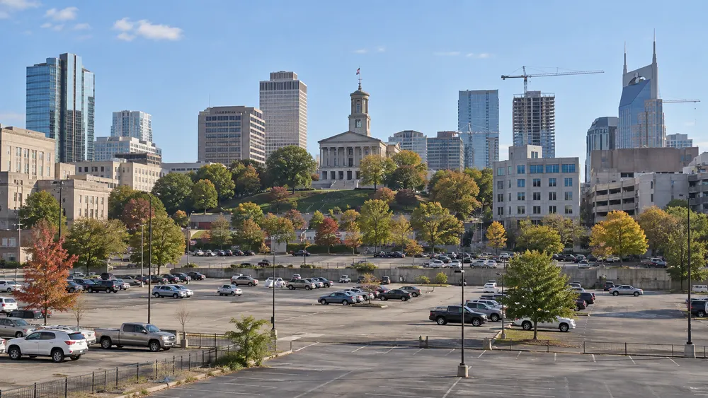 Surface parking lots and surrounding buildings in a generic downtown Nashville Capitol-area setting.