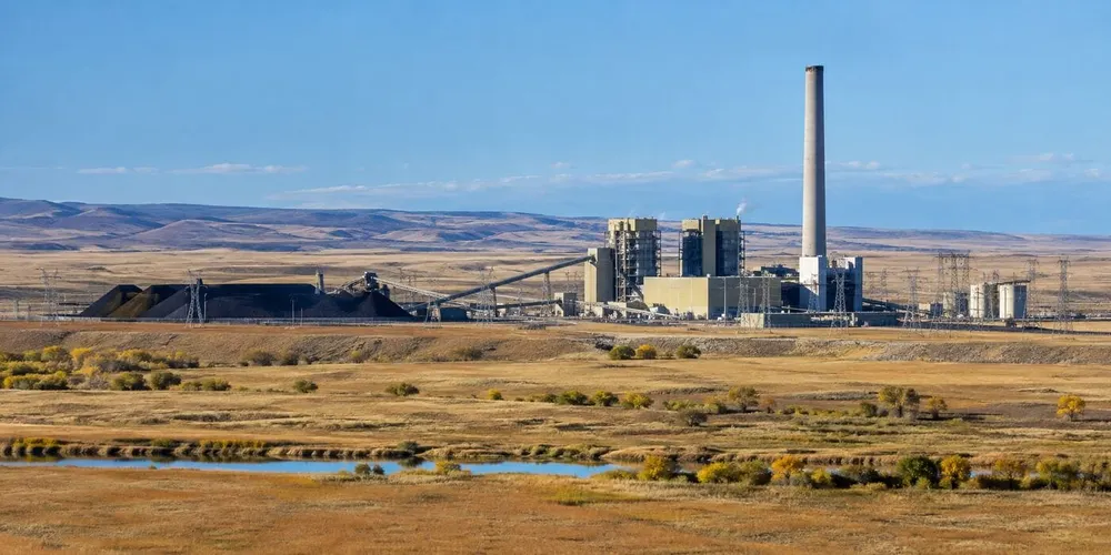 Illustration of a coal-fired power station and transmission lines across Wyoming's high plains.