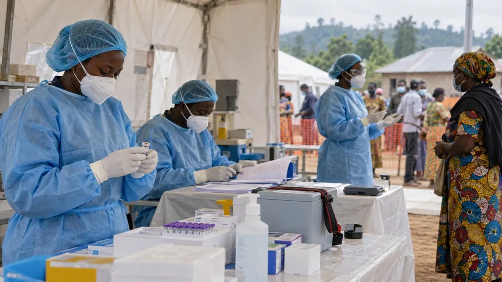 Healthcare workers prepare vaccine and screening supplies at a community public-health station.