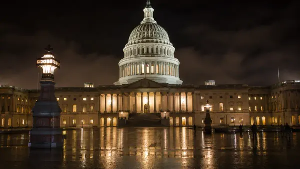 The United States Capitol illuminated at night as Washington debates new federal gun-policy actions.