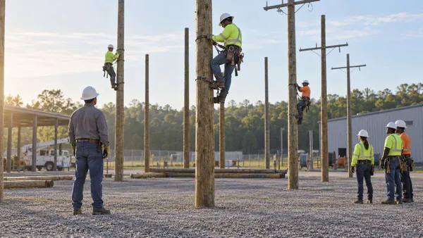 Illustration of adult lineworker trainees practicing on de-energized utility poles at a generic training yard.