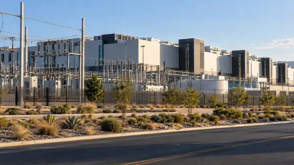 Illustrative view of a modern California data center with electrical equipment and drought-tolerant landscaping.