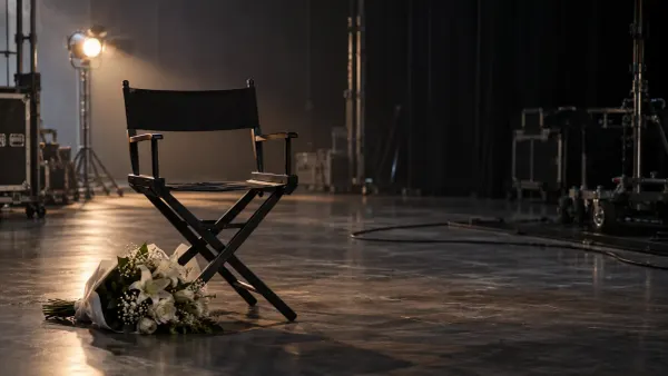 An empty director’s chair and white flowers on a quiet television soundstage
