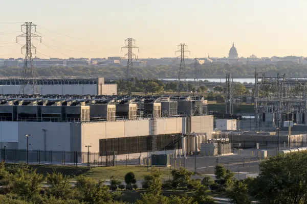 Data center and electrical transmission equipment with the U.S. Capitol in the distance
