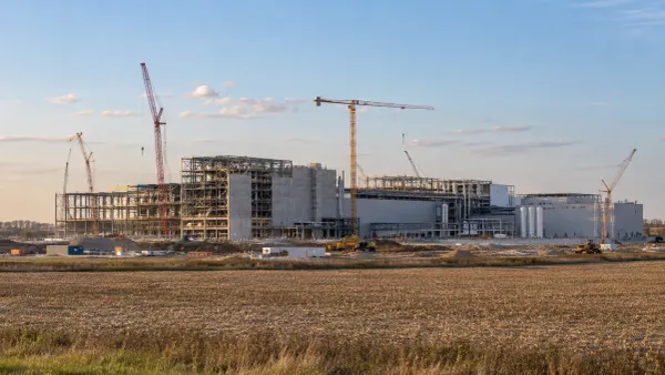 A large semiconductor fabrication plant under construction beside Ohio farmland