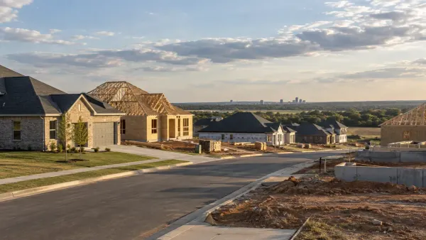 New single-family homes in different stages of construction in an Oklahoma neighborhood