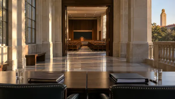 Empty counsel tables facing a university lecture hall in a symbolic editorial scene about campus speech litigation