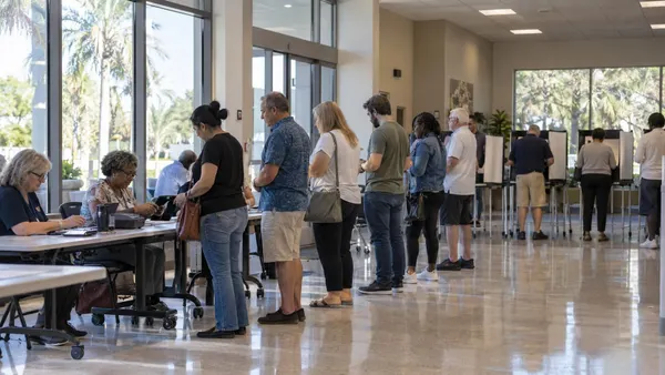 Voters wait in an orderly line at a Florida early-voting location.