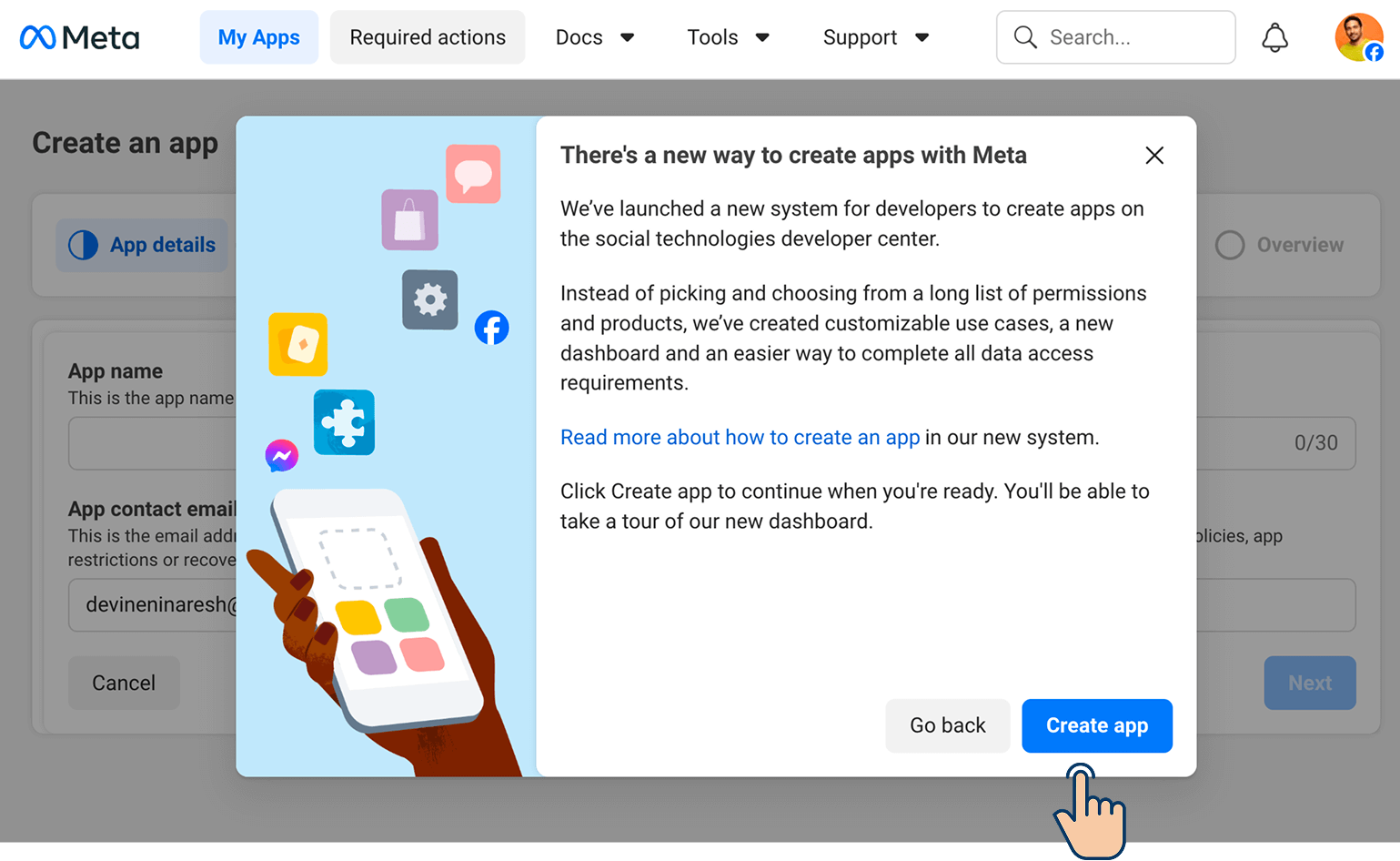 Meta Developer portal showing the "There's a new way to create apps with Meta" pop-up dialog, with a cursor pointing at the "Create app" button in the bottom-right corner.